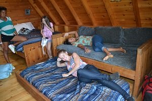 kids in log cabin